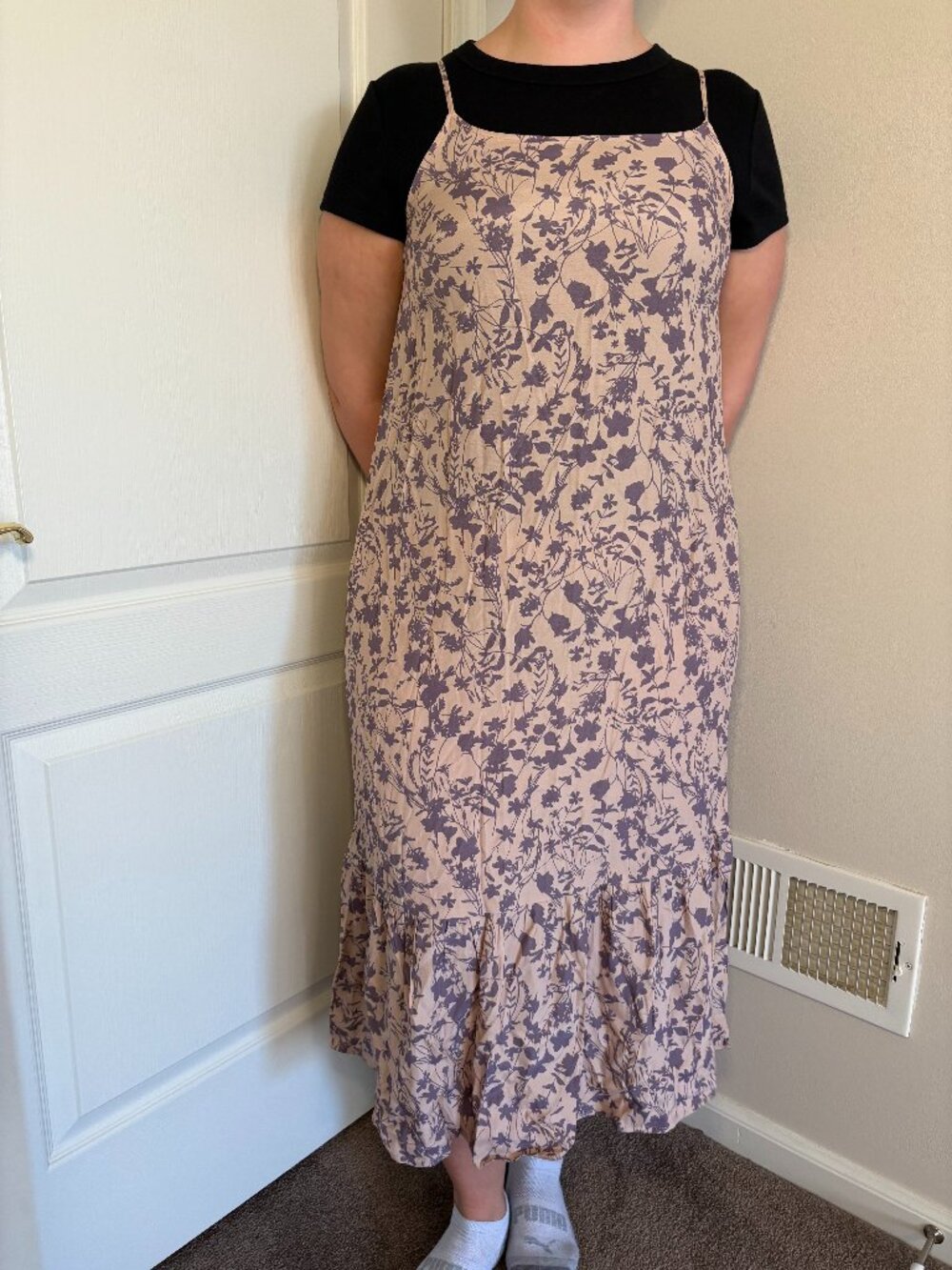 Pink and purple spaghetti strap dress with a floral print and pockets.